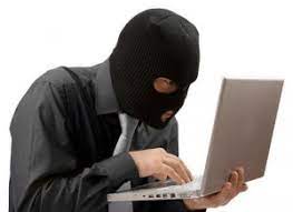 avoid make money scams - masked bandit on a laptop
