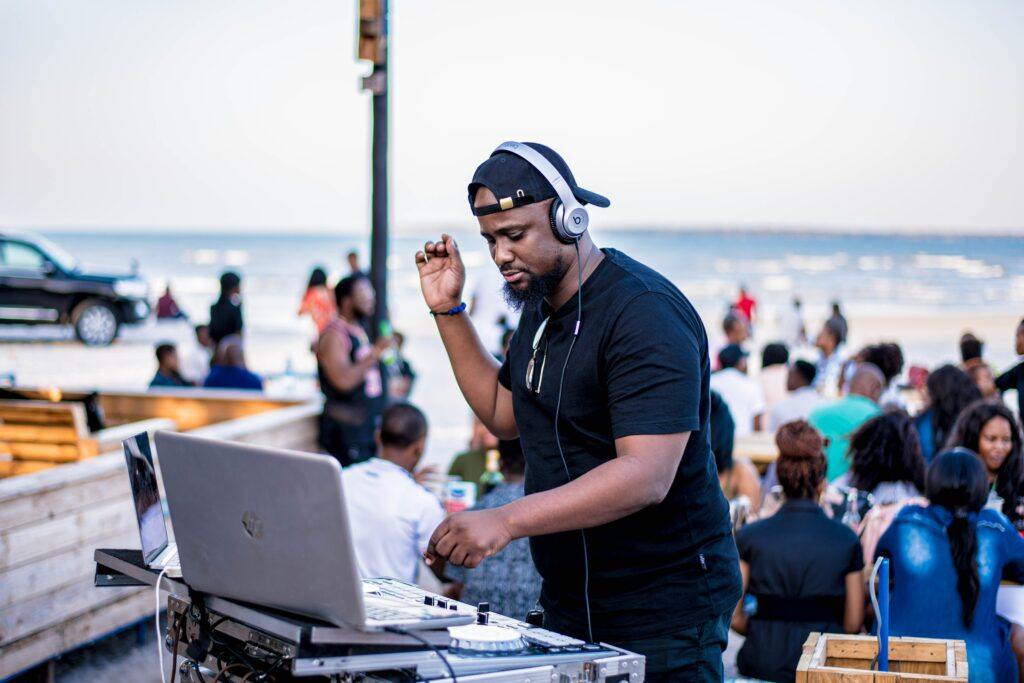 Make money from your passion for music - DJ at the beach playing music for the crowd