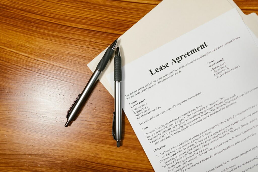 Lease agreement on a table waiting for signatures