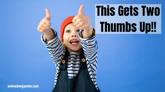 Young boy giving the "two thumbs up" sign