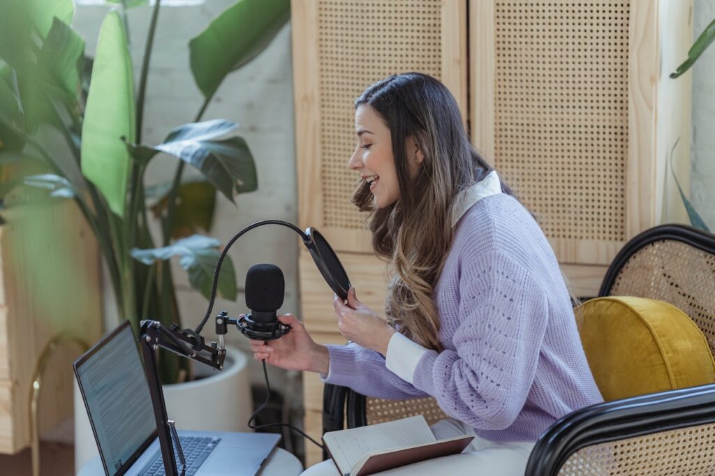 How to work from home on your computer - young lady working from home on her computer and conducting a zoom meeting