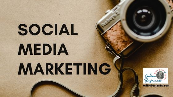 Social Media Marketing is spelled out on a desktop with a camera next to it.