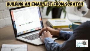 Email list building - an image of someone working at their desk on a laptop computer going over an email list.