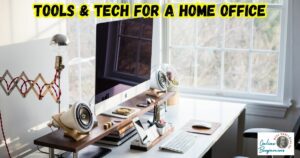 Tools and Tech for a Remote Office featured image with an office set up showing desktop computer, microphone, speakers, and phone holder.